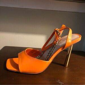 Orange women’s heel with chain